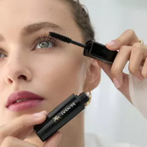 Close up of person applying Lash Volumiser 38C while holding tube in the other hand 